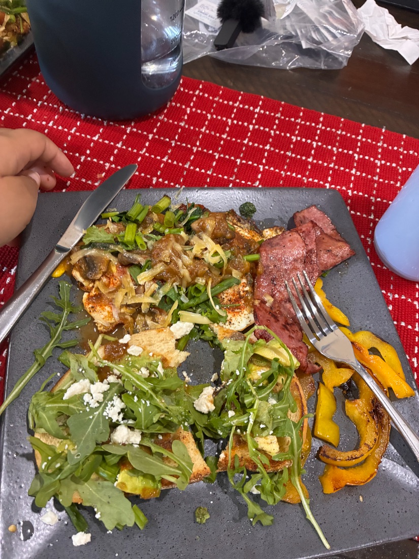 A plate of greens, roasted squash and eggs