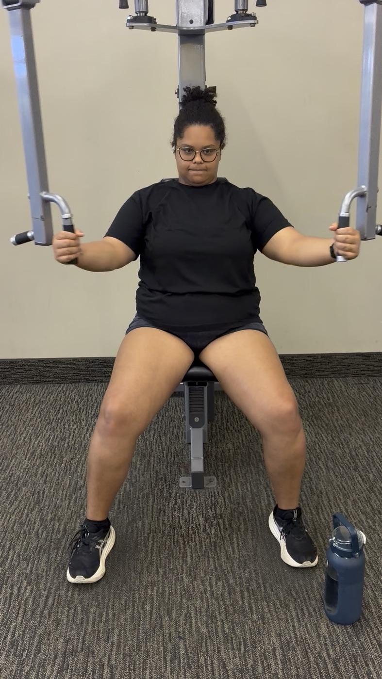 Nicole today, working out on a chest press machine at the gym