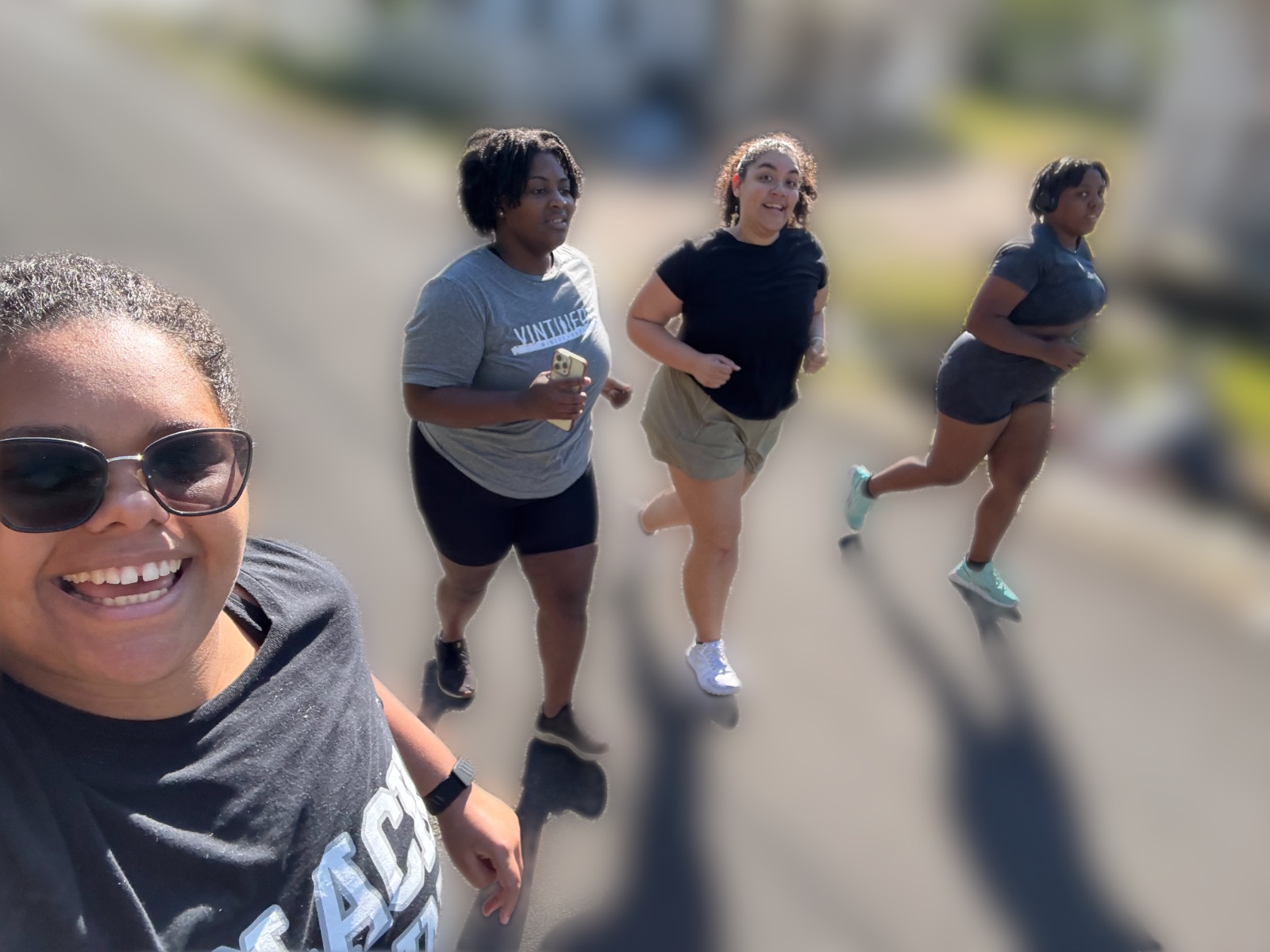 Mya, Magleny and friends running together on a sunny morning